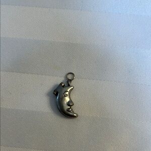 Hinged man in the moon pendant